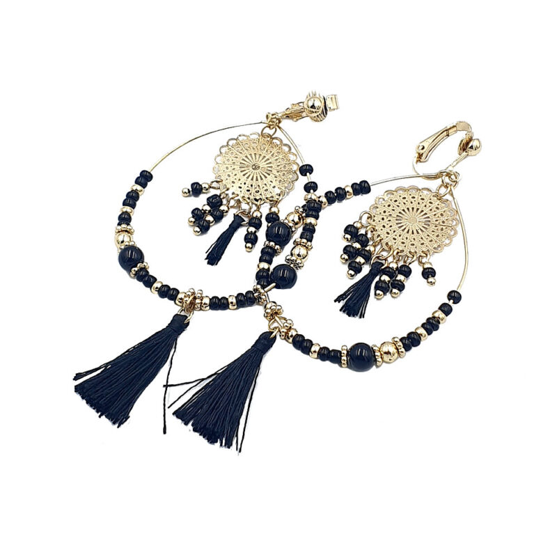 Gold-tone hoop earrings with navy beads, filigree discs, and navy tassel charms