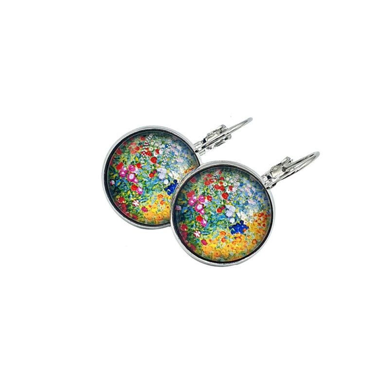 Pair of round earrings with a colorful floral pattern and silver setting, shown against a white background.