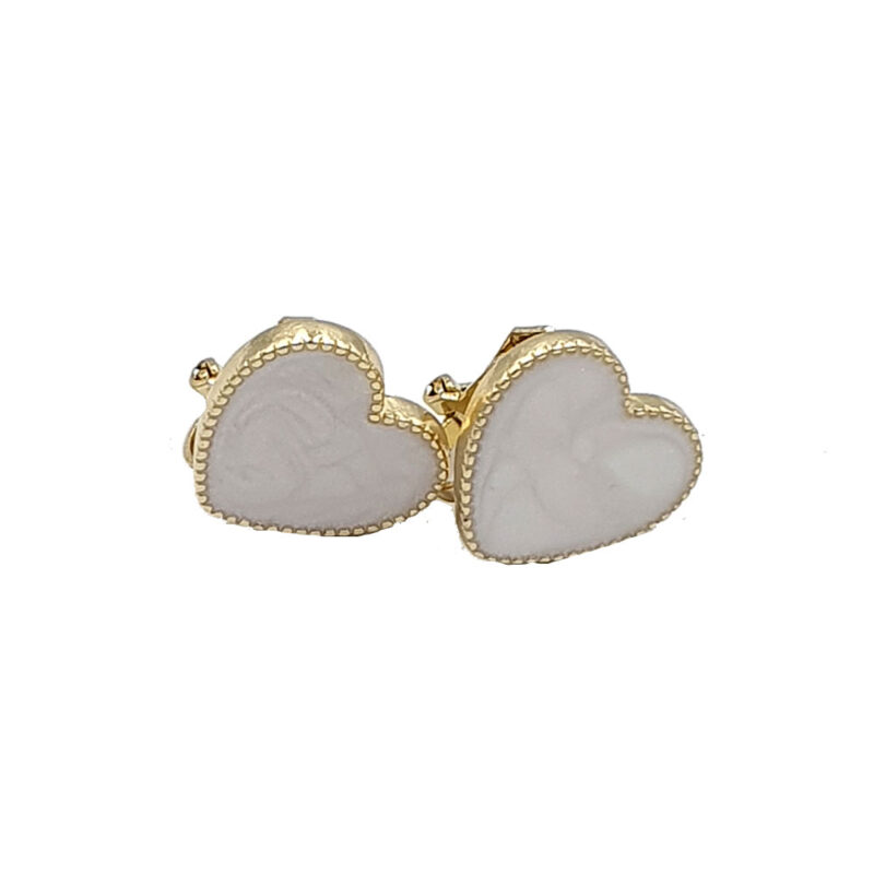 Pair of heart-shaped earrings with gold edging and white marbled stones.
