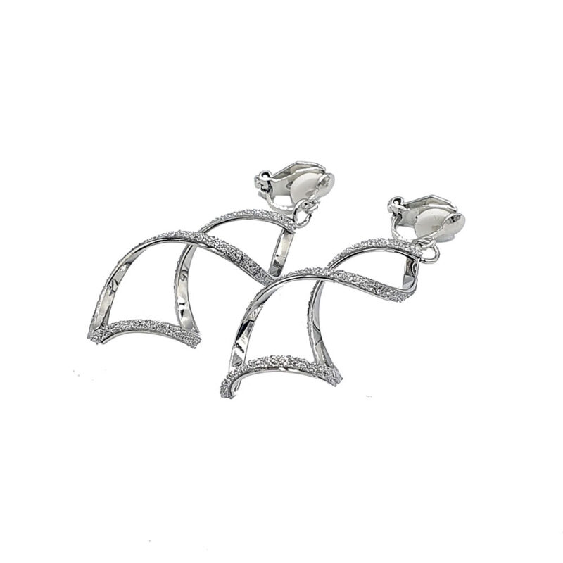 Pair of silver drop earrings with curved arches encrusted with small stones for sparkle.