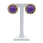 Purple cabochon stud earrings with gold twisted rope border on a white display stand