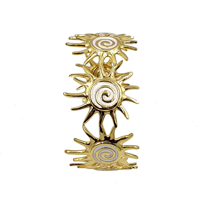 Gold-tone sunburst link bracelet with spiral-centered discs on white background