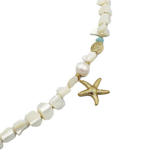 Beaded seashell necklace with a gold starfish charm on a white background.
