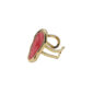 Gold adjustable ring featuring an oval pink stone in a gold bezel setting
