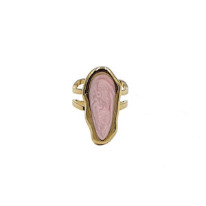 Gold-tone ring with an elongated pink carved cameo set in a bezel on a split-band design; features a raised relief figure.