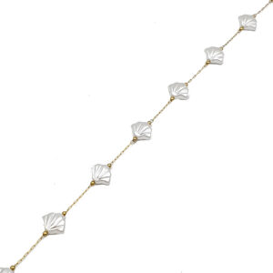 Delicate gold chain necklace with white shell-like beads spaced along the chain, shown diagonally on a white background.