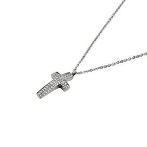 Silver cross pendant necklace encrusted with small diamonds on a delicate chain on a white background