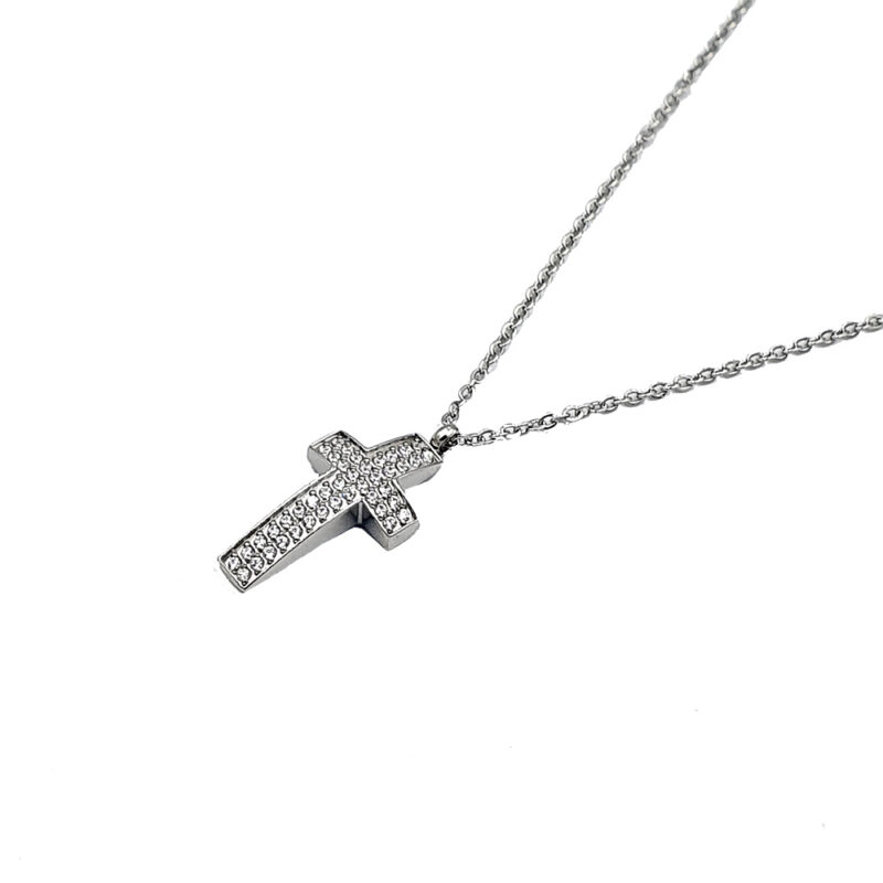 Silver cross pendant necklace encrusted with small diamonds on a delicate chain on a white background