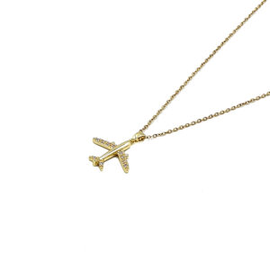 Gold chain necklace with a small diamond-studded airplane pendant on a white background.