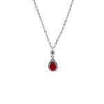 Silver chain necklace with a red teardrop gemstone pendant surrounded by small diamonds on a white background.