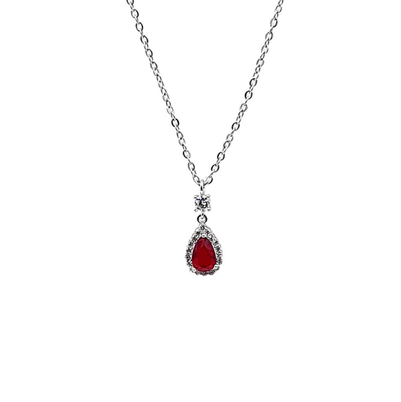 Silver chain necklace with a red teardrop gemstone pendant surrounded by small diamonds on a white background.