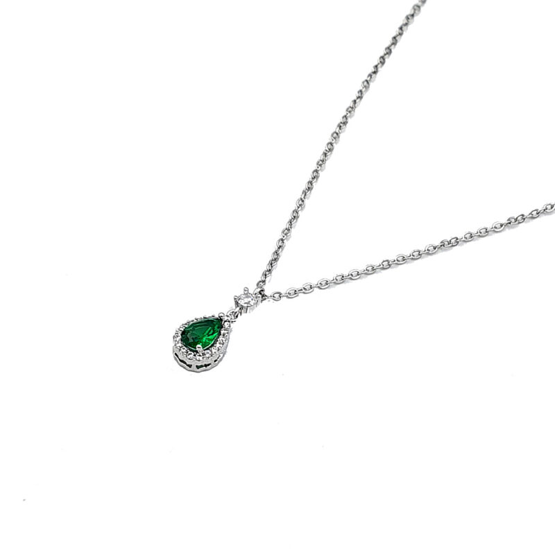 Silver chain necklace with a teardrop green gemstone pendant surrounded by small crystals.