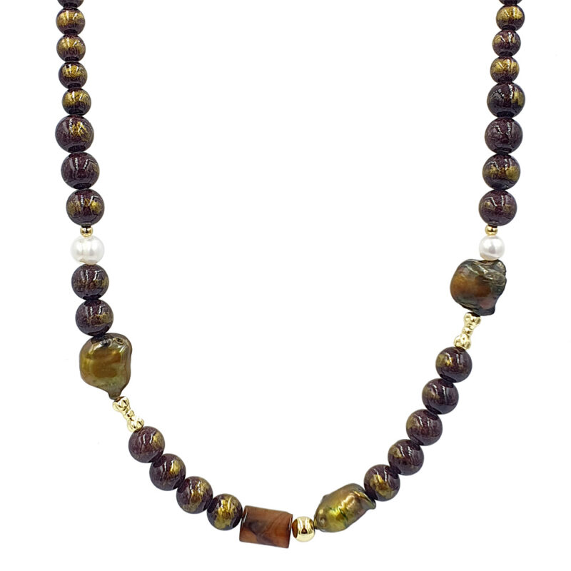 Beaded necklace with dark purple speckled beads, white pearls, and a central rectangular brown bead with gold spacers.
