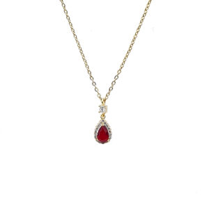 Gold chain necklace with a teardrop red gemstone pendant surrounded by small clear stones and a tiny diamond above, on a white background.