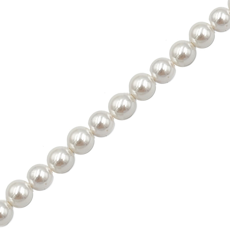 Row of white pearl beads on a string, close-up diagonal view of a pearl necklace