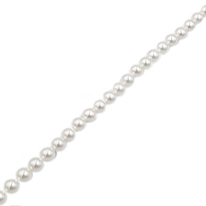 Diagonal strand of shiny silver beads (pearl-like) on a white background, a close-up of a jewelry necklace component