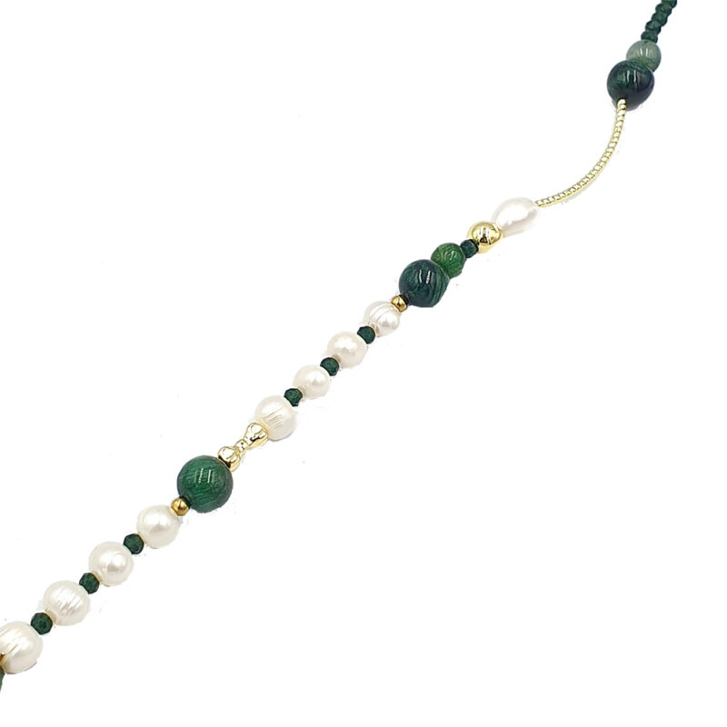 Beaded necklace with white pearls, dark green beads, and small gold spacers on a thin golden chain.