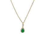Gold chain necklace with a teardrop green gemstone pendant surrounded by small diamonds
