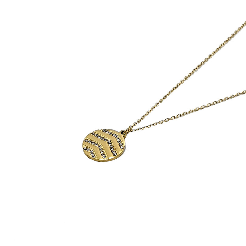 Gold pendant necklace with a circular striped design encrusted with small crystals on a thin chain.